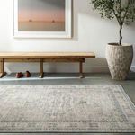 Lila Slate/Amber rug shown flat on floor in contemporary room setting with bench, plant, and framed artwork