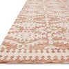 Low angled view showing rug's textured power-loomed surface and clean, finished edges