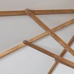 Detail of wooden support braces inside canopy frame of umbrella