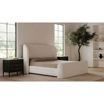 Lower side view with open storage drawer holding folded bedding, set on carpet under bed