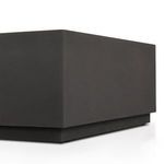 Close-up focusing on the corner edge lines and slatted top of the coffee table
