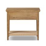 Back view of nightstand showing solid oak panel and woven shelf beneath