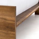 Close-up showing side rail with visible wood grain and connection to headboard
