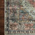 close-up of rug corner showing detailed weave and stitched edge on dark hardwood floor