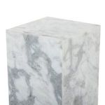 Close-up angled view showing smooth marble top and veining detail on surface