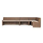 Coastal style Senna Dining Banquette in rattan with soft lines and cream fabric cushion in an angled sectional shape