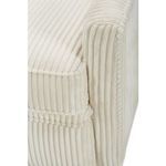 Close-up of barrel back side seam and cushion piping detail with vertically ribbed upholstery