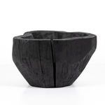 Side angle of smaller bowl focusing on curved rim and natural wood cracks