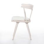 Side angled view of Ripley Chair emphasizing sculptural oak frame and cushion depth