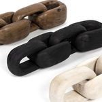 View of three wooden chain segments highlighting distinct natural brown, black, and white colors