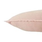 angled close-up of pillow edge displaying detailed fringe trim