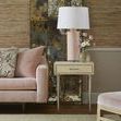 Jolene side table styled in sitting room next to pink velvet sofa with lamp and flowers on top