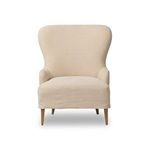 Omar Chair angled right with wingback and tapered wooden legs visible