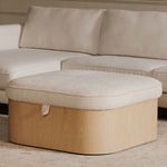Sonny ottoman closed in living room with sofa background on light-colored carpet