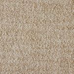 Close-up showing looped boucle weave texture and fabric color variation on armrest