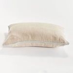 Side view of Elias Pillow showing light blue piping detail running along the edge