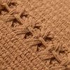 Close-up of woven stripe detail and texture on center of Harvey Orange Pillow in muted orange cotton