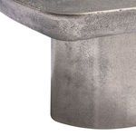 Close-up of textured graphite surface and curved edge above the smooth metal base