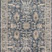 Teagan Denim Pebble Rug with vintage-inspired intricate floral and geometric pattern in muted blue, beige, and gray tones
