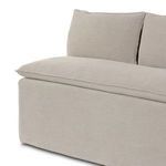 Close-up angled view of feather-blend seat cushion and linen slipcover