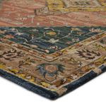 Close-up angled view showing plush texture and detailed woven floral motifs on rug corner