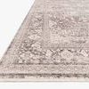 Side angle view of Homage Ivory Grey Rug highlighting low pile texture and faded border design