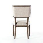 Back view of Jax Dining Chair showing rectangular padded backrest and exposed wood frame