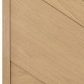 Close-up of diagonal wood grain and joint patterns on cabinet door panels