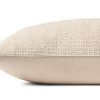 Side profile of pillow showing smooth cotton fabric on back and textured woven stripe front