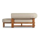 Opposite side profile showing low sculptural back with teak frame details