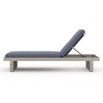 Side profile of Leroy Outdoor Chaise showing low frame and support mechanism for reclined backrest