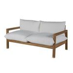 Close-up of teak frame corner leg with brass capped foot on outdoor loveseat