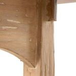 Close detail of table's arched support under the solid pine tabletop