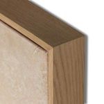 Detail of natural wood frame corner with visible grain around painting