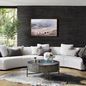 Sectional divided into two crescent curved parts around a patterned black and white rug