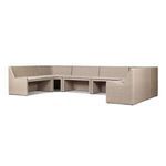 Side angle view showing the textured rattan frame and curved backrest on the dining banquette