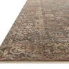 Low angled side view showing the rug’s flat finish and detailed edge stitching