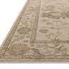 Close-up side angle showing the rug’s pile height and texture with floral border detail