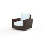 Swivel rocker club chair with cognac multi-colored resin wicker and white cushions