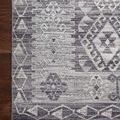 Close-up on rug corner with clearly visible edge stitching and wood floor underneath Zion Charcoal Slate rug