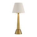 Saunter Brass Cordless Table Lamp in styled shot on table with gold-accented glassware and green velvet sofa