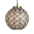 Hanging pendant softly lit in ornate green room with floral molding and window light