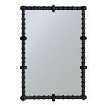 Straight-on front view of the mirror highlighting symmetrical beaded wood detailing on frame