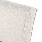 Close-up showing upper curve and upholstery detail of Hobson chair's backrest