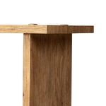 Macro view of pull-through joinery where side panel meets the table top edge