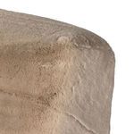 Fine detail of the chair’s corner showing plush fabric and slight color variation