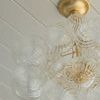 Close-up from slightly side angle highlighting the textured swirl pattern on glass orbs