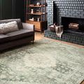 Rosette teal and ivory rug shown in a living room with sofa and fireplace, highlighting room styling and scale