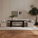 Full dining setting showcasing multiple Fable banquettes around a dark wood dining table in a styled room