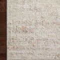 Corner detail of the rug on hardwood floor highlighting texture and finishing edge
